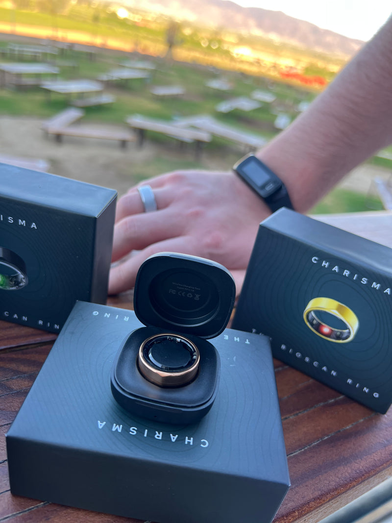 Person holding Charisma camera lens with packaging outdoors