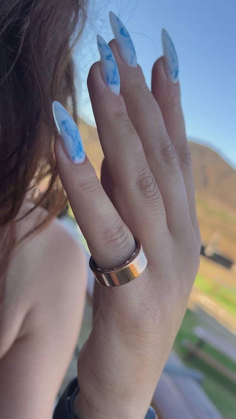 a female hand wearing the frequently Siliver ring
